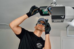 PDS worker checking the garage door meter.