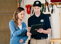 service person and client looking at ipad