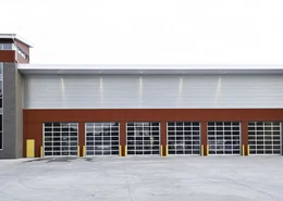 Red and gray fire station garage doors.