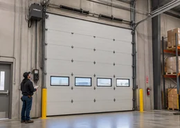 Precision Door professional repairing warehouse garage door.
