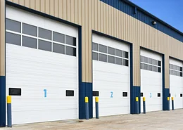 Industrial garage doors with top windows.