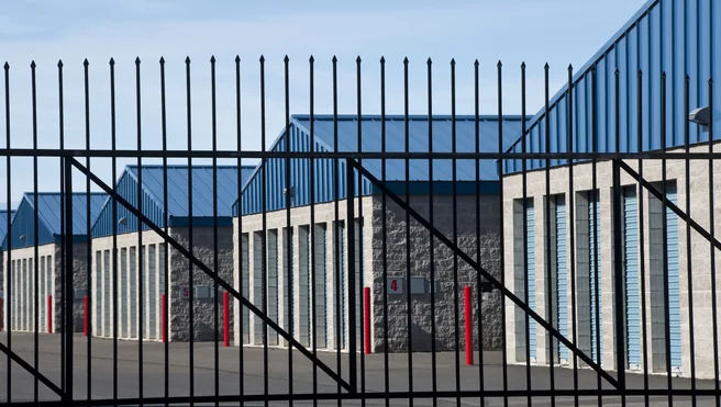 Storage units behind gate.