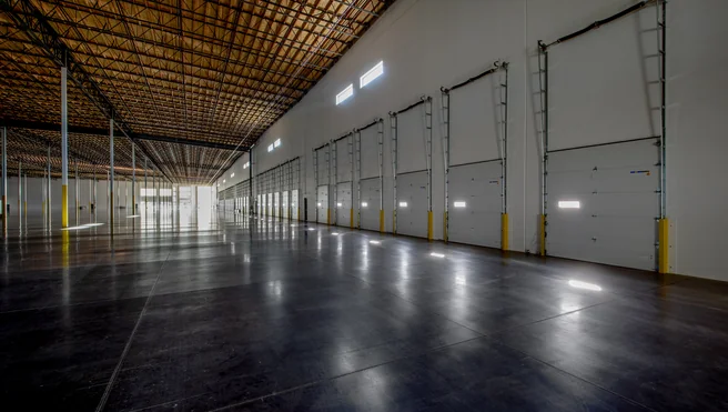 Sectional garage doors in warehouse.