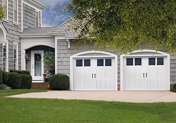 A house with a double garage door.