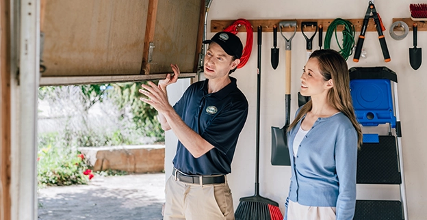 A PDS expert and client talking next to the garage door.