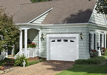 A house with a single garage door.