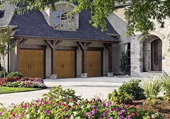 A house with a triple garage door.