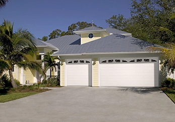 A house with a triple garage door.