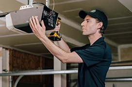 A PDS expert working on a garage door meeter.