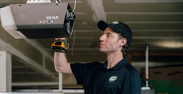 A PDS expert working on a garage door device.