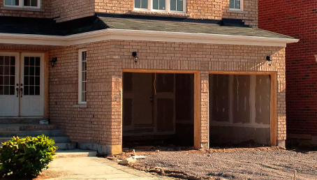 A garage door frame is finished and ready for the door installation.