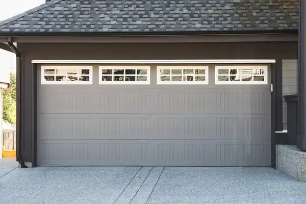 4-panel sectional garage door with windows.