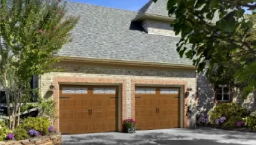 A simple garage with doors that look like wood.