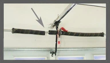 Broken Garage Door Torsion Spring.