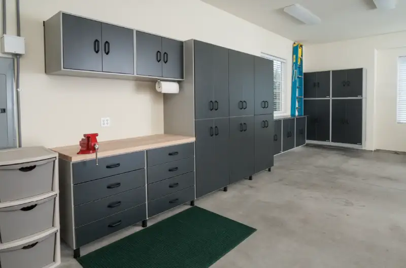 A remodeled garage with robust cabinetry and storage.