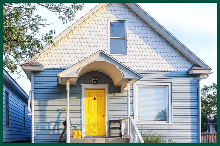 Bungalow with scallop siding on gable.