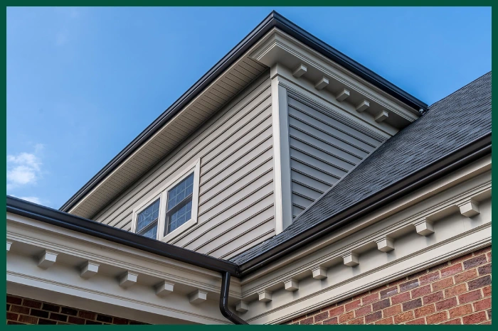 Decorative molding on a grey house.