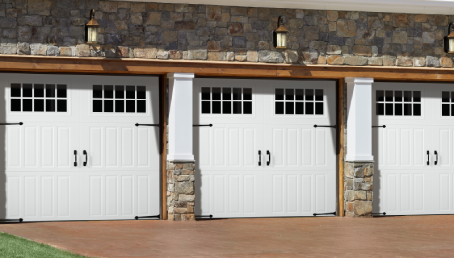 Three swing-out garage door on a brick house.